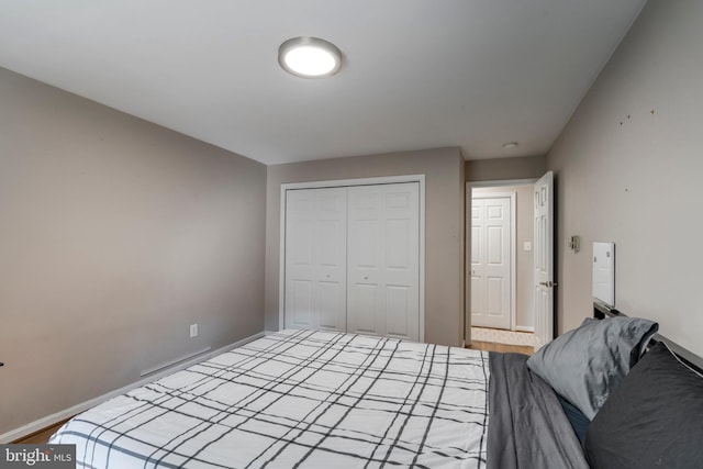 unfurnished bedroom featuring a closet and baseboards