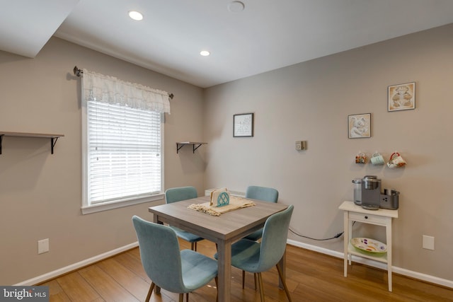 dining area with recessed lighting, baseboards, and wood finished floors