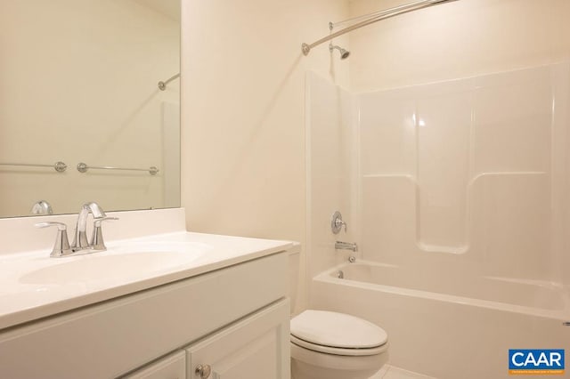 bathroom featuring shower / washtub combination, toilet, and vanity