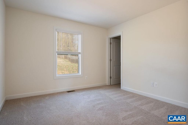 unfurnished bedroom featuring carpet flooring, baseboards, and visible vents