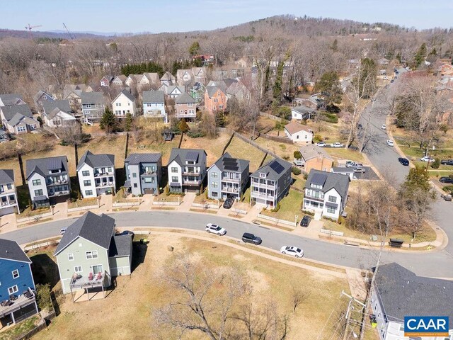 birds eye view of property with a residential view