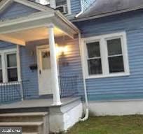 view of exterior entry with covered porch