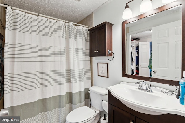 full bath with a shower with curtain, a textured ceiling, vanity, and toilet