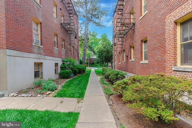 view of property exterior featuring brick siding