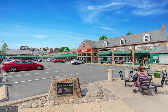 view of property with uncovered parking