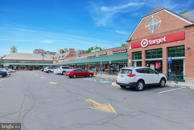 view of property featuring uncovered parking