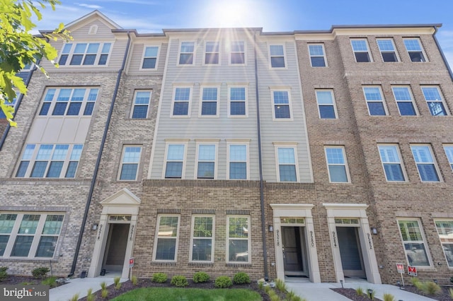 multi unit property featuring brick siding