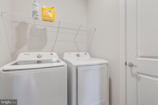 laundry area with laundry area and independent washer and dryer