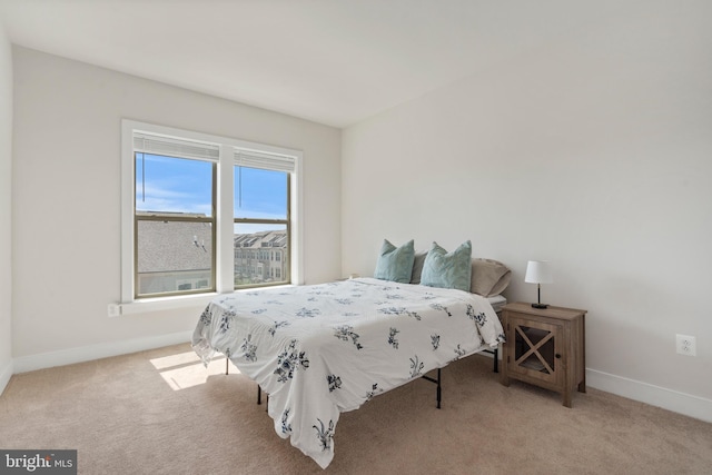 carpeted bedroom with baseboards