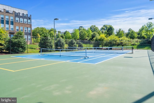 view of sport court with community basketball court and fence