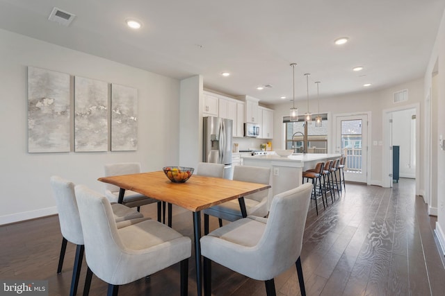 dining space featuring recessed lighting, visible vents, and dark wood-style flooring