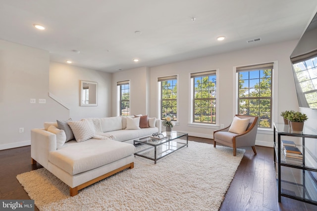 living area featuring dark wood finished floors, visible vents, plenty of natural light, and recessed lighting