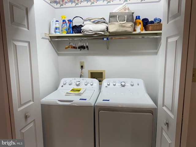 clothes washing area with laundry area and washing machine and dryer