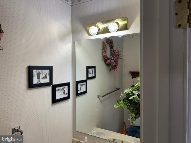 bathroom featuring wallpapered walls