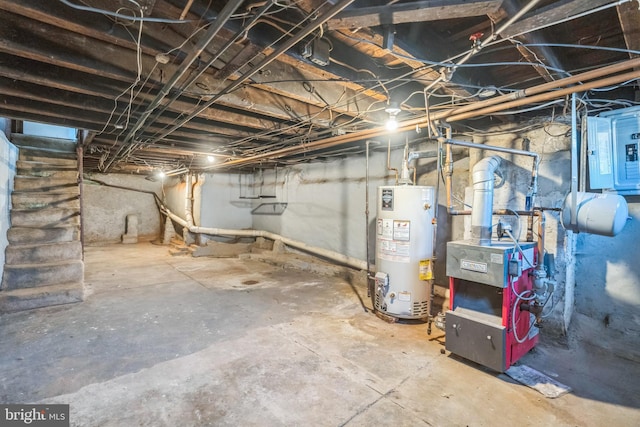 unfinished basement featuring electric panel, a heating unit, and water heater