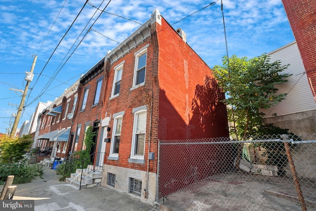 view of property with fence