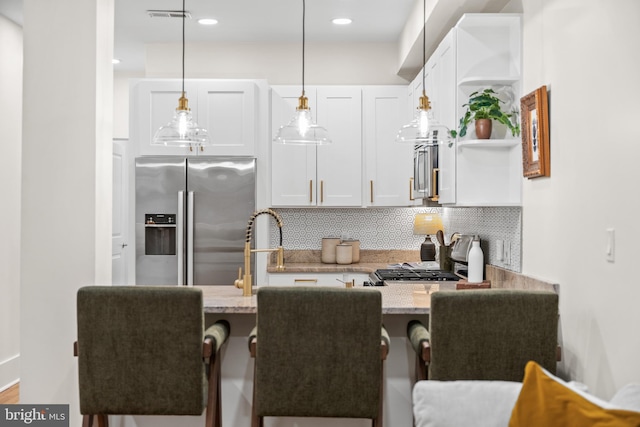 kitchen featuring open shelves, stainless steel fridge with ice dispenser, decorative backsplash, white cabinets, and pendant lighting