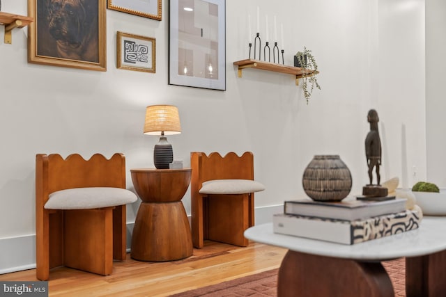 sitting room featuring wood finished floors