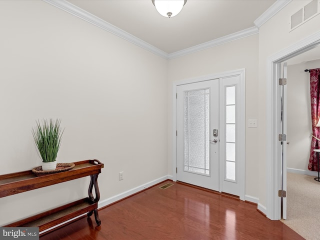 23811 Pembroke Ln, Millville, DE 19967 - foyer entrance with crown molding, visible vents, baseboards, and wood finished floors