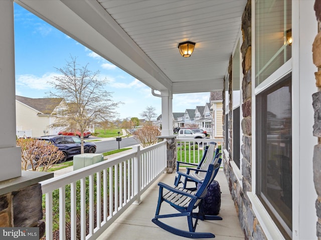 23811 Pembroke Ln, Millville, DE 19967 - balcony featuring a residential view and a porch