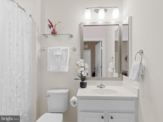 23811 Pembroke Ln, Millville, DE 19967 - full bath featuring a shower with shower curtain, vanity, and toilet