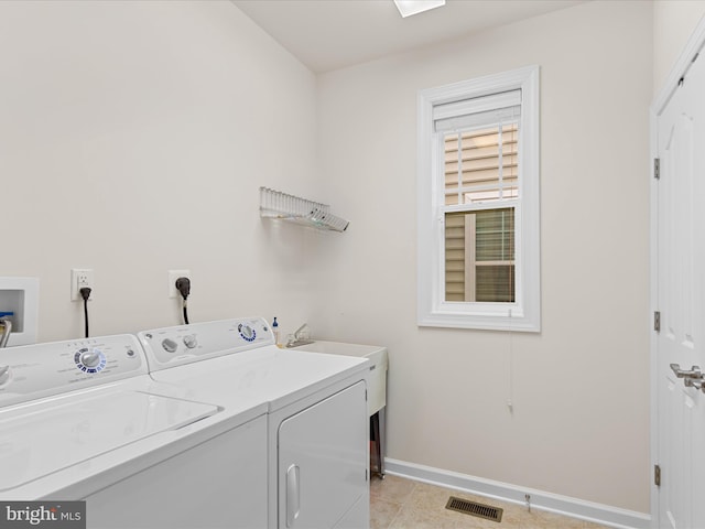 23811 Pembroke Ln, Millville, DE 19967 - washroom featuring laundry area, visible vents, light tile patterned flooring, washer and dryer, and baseboards