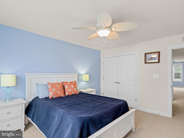 23811 Pembroke Ln, Millville, DE 19967 - bedroom with a closet, light colored carpet, a ceiling fan, visible vents, and baseboards