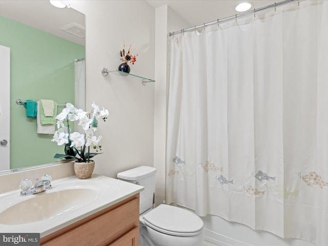 23811 Pembroke Ln, Millville, DE 19967 - bathroom featuring toilet, vanity, shower / bath combo with shower curtain, and visible vents
