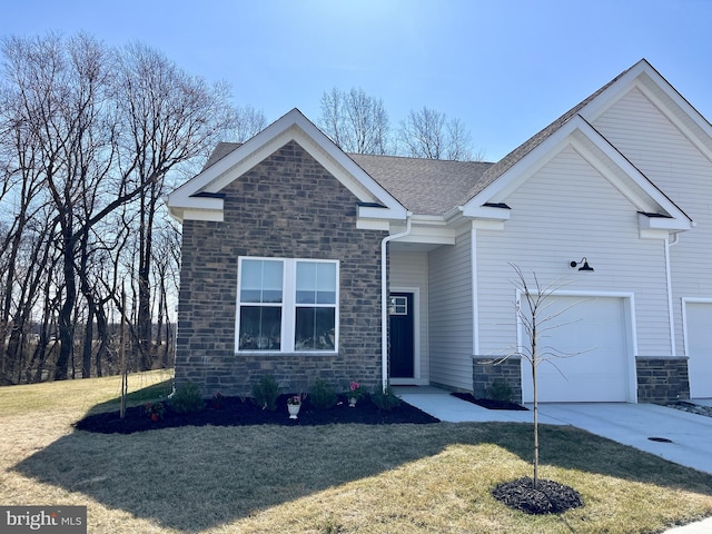 view of front facade featuring a garage, stone siding, roof with shingles, and a front yard