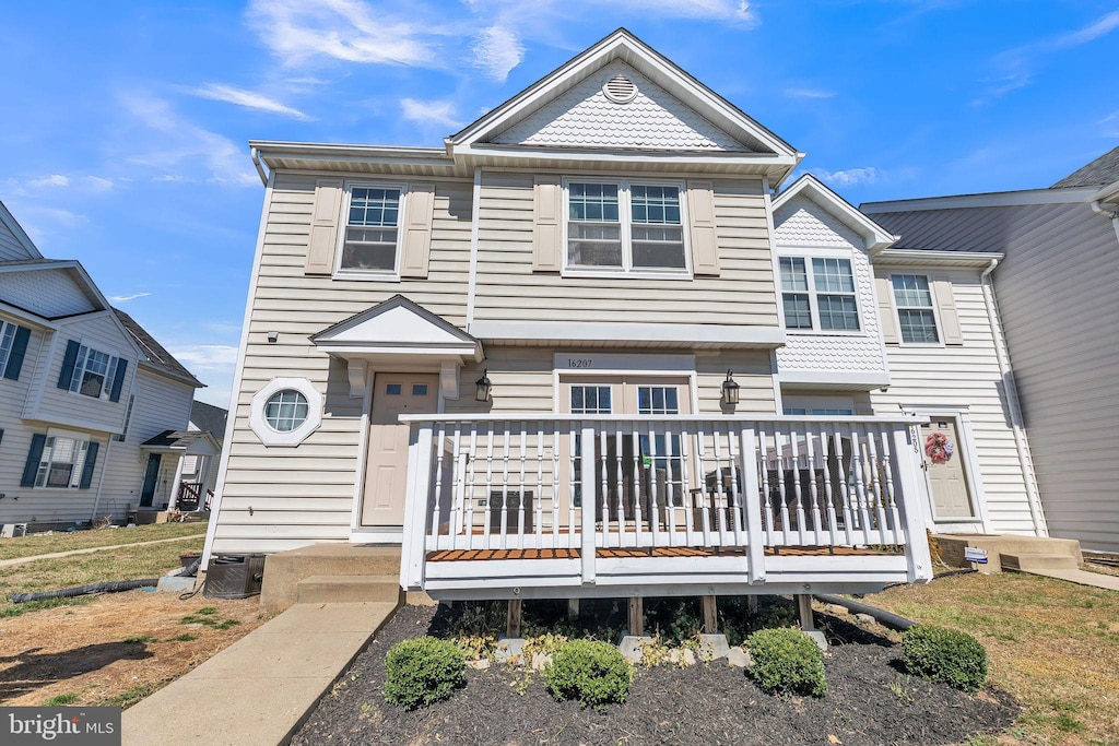 view of property featuring a wooden deck