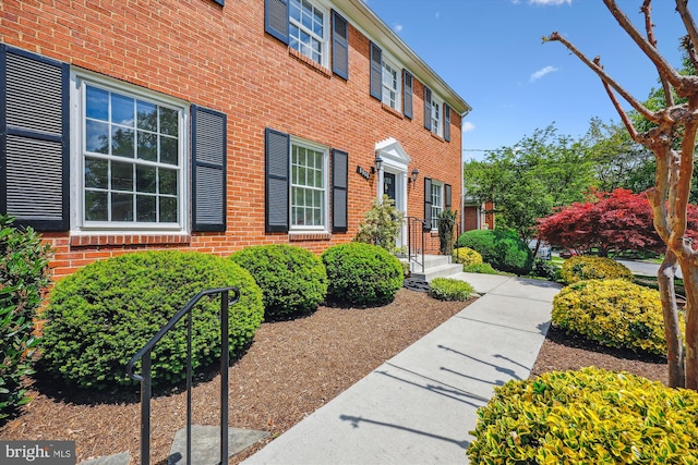 exterior space with brick siding