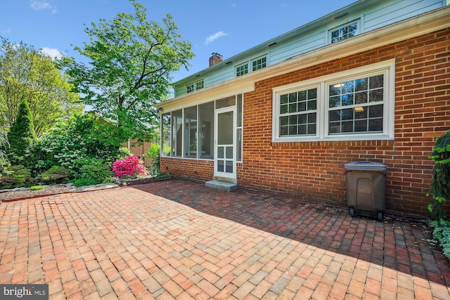 view of patio / terrace with a sunroom