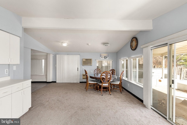 dining room with baseboards, light carpet, vaulted ceiling with beams, and a wall mounted AC