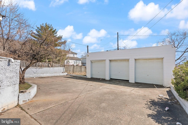 detached garage with fence