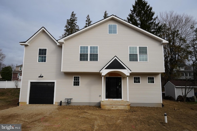 colonial home featuring an attached garage