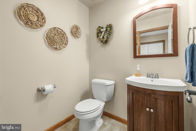 4270 Beulah Rd, Hurlock, MD 21643 - bathroom featuring toilet, vanity, tile patterned floors, and baseboards