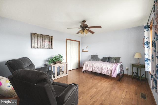 4270 Beulah Rd, Hurlock, MD 21643 - bedroom with a closet, visible vents, a ceiling fan, and wood finished floors