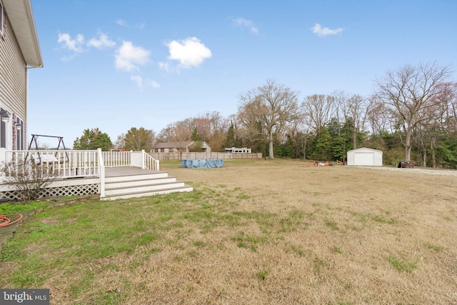 4270 Beulah Rd, Hurlock, MD 21643 - view of yard with a wooden deck, an outdoor structure, a garage, and a storage shed