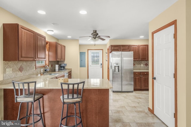 4270 Beulah Rd, Hurlock, MD 21643 - kitchen featuring a wealth of natural light, a ceiling fan, a kitchen bar, stainless steel fridge, and a peninsula