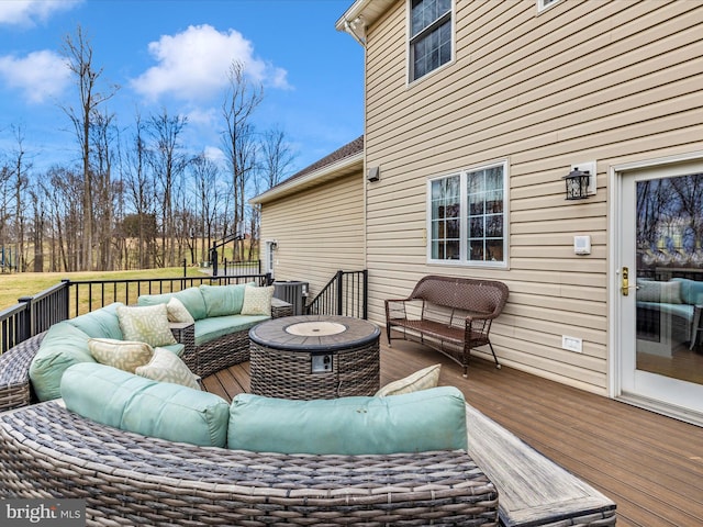 deck featuring central AC and an outdoor hangout area