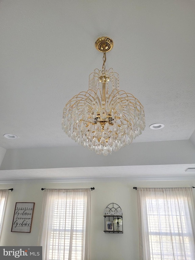 interior details featuring recessed lighting and a notable chandelier