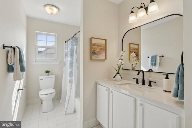 bathroom featuring tile patterned floors, toilet, vanity, and baseboards