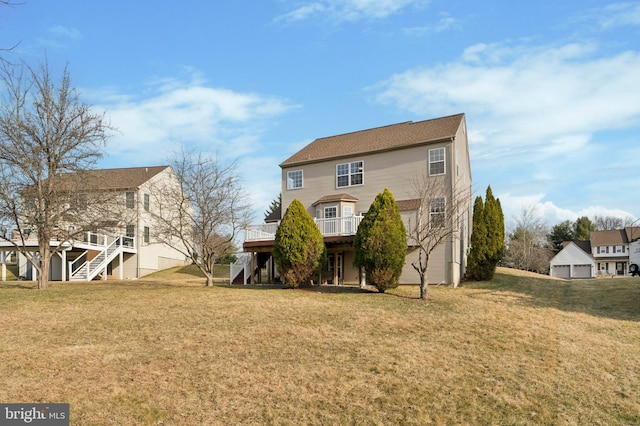 view of front of house with stairs, a front lawn, and a wooden deck