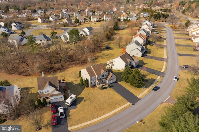 birds eye view of property with a residential view