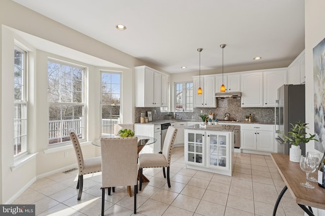 dining area with light tile patterned flooring, recessed lighting, and baseboards