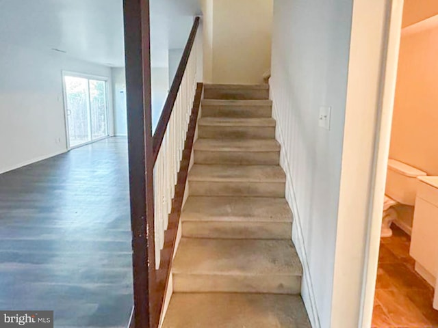 stairs with wood finished floors