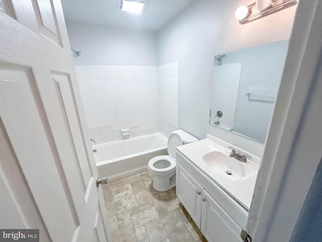 bathroom with vanity, toilet, and bathing tub / shower combination