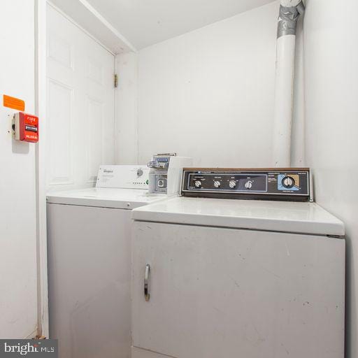 laundry room with separate washer and dryer and laundry area