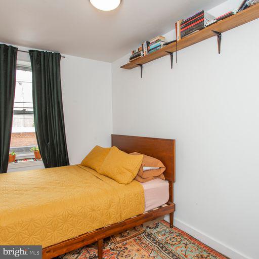 bedroom featuring baseboards