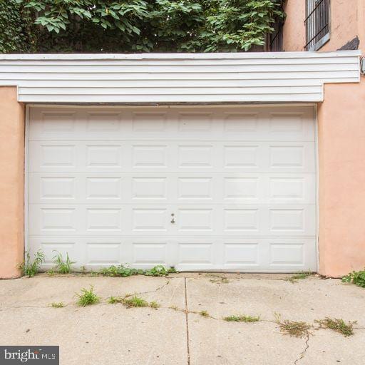 garage featuring driveway